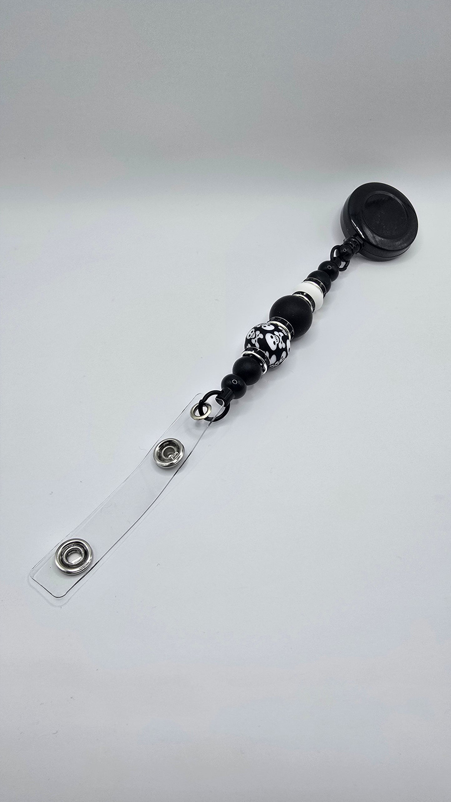 Badge Reel: Black with Skulls